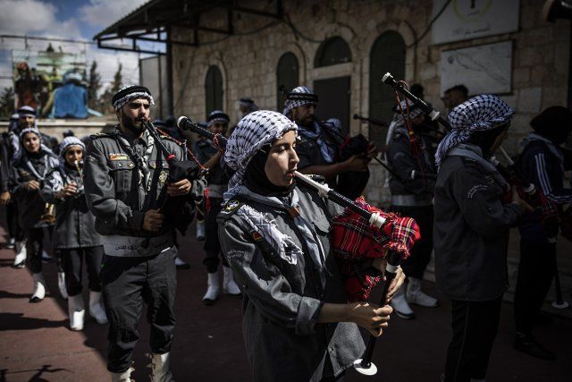 08 October 2022, Israel, Jerusalem: Palestinian scouts play their musical instruments during a parade organized to mark "Mawlid", the birthday of Islam\