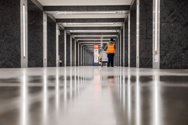 01 October 2022, Berlin: A cleaner pushes her cart through the Museum Island subway station. Photo: Christoph Soeder\/dpa