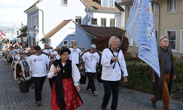 02 October 2022, Konstanz: After a church service, a procession as part of a planned peace chain at Lake Constance goes to the Constance "Hörnle". The planned peace chain at Lake Constance failed on Sunday. Regarding the demands that were to be communicated with the action, the organizers\