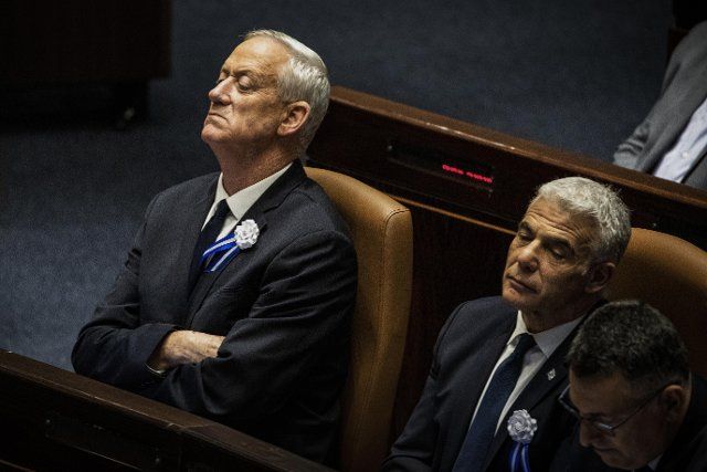 15 November 2022, Israel, Jerusalem: Israeli Prime Minister Yair Lapid (R) and Israeli Defence Minister Benny Gantz attend a session covened for the swearing in of Israel\