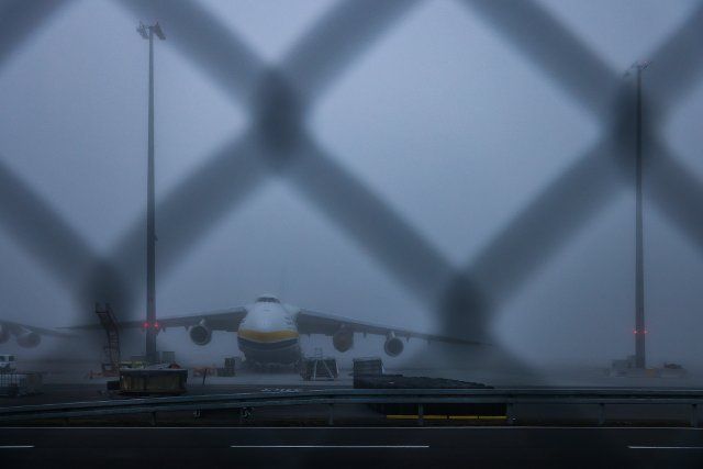 01 December 2022, Saxony, Schkeuditz: A Ukrainian Antonov An-124 stands in the fog at Leipzig\/Halle Airport. The aircraft belong to Ukraine\