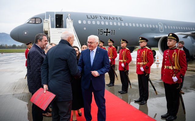 01 December 2022, Albania, Tirana: Federal President Frank-Walter Steinmeier arrives at the International Airport "Nene Tereza" and is welcomed there by Peter Zingraf, Ambassador of the Federal Republic of Germany in Albania. During his four-day trip to the Balkans, President Steinmeier will visit the countries of Northern Macedonia and Albania. In addition to the situation in the region and the repercussions of the Russian war of aggression in Ukraine, the trip will focus on Germany\