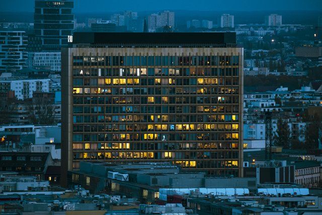 08 November 2022, Berlin: Numerous offices in the Axel Springer building are lit up in the evening. Photo: Paul Zinken\/dpa