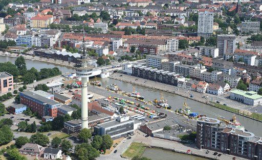 15 June 2018, Germany, Bremerhaven: The aerial view shows the tugboat fleet at the port. Photo: Carmen Jaspersen\/
