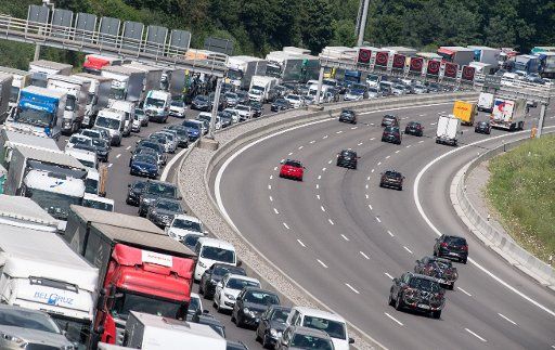 12 July 2018, Stuttgart, Germany: Cars and Trucks stuck in traffic on road A8. Photo: Sebastian Gollnow\/