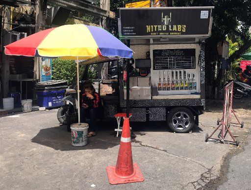 21 July 2018, Thailand, Bangkok: A revamped tuk-tuk serves as a coffee shop. Photo: Christoph Sator\/