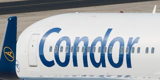 12 September 2018, Hessen, Frankfurt\/Main: A passenger aircraft of the airline Condor stands on the apron of Frankfurt Airport. Photo: Silas Stein\/