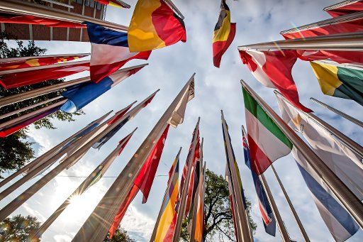 13 September 2018, Bavaria, Munich: Flags of all European countries flying in the wind before the European Patent Office. Photo: Peter Kneffel\/