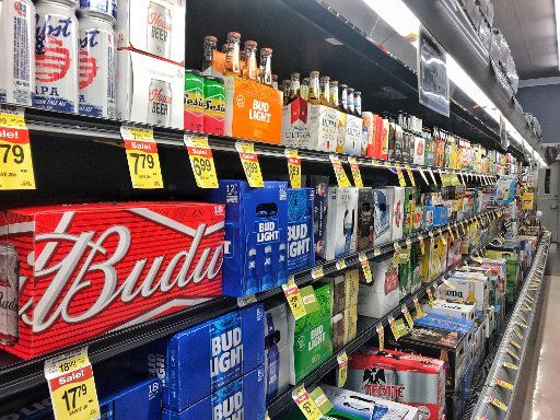 16 June 2018, US, Denver: Different types of beer are stored in a refrigerated shelf of a supermarket. Photo: Soeren Stache\/dpa-Zentralbild\/