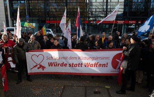 17 November 2018, Berlin: Participants of the demonstration "dignity instead of weapons" of the action "#stand up" stand in front of the SPD federal headquarters in Stresemannstraße. Photo: Paul Zinken\/