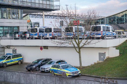 20 December 2018, Baden-Wuerttemberg, Stuttgart: Police vehicles are parked in front of a check-in hall at the airport. Following indications of spying attempts, security measures have been strengthened. (to dpa: "Spying attempts? - Higher security measures at Stuttgart Airport" of 20.12.2018) Photo: Sven Kohls\/SDMG\/