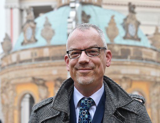 01 February 2019, Brandenburg, Potsdam: Christoph Martin Vogtherr, General Director of the Prussian Palaces and Gardens Foundation, stands in front of a Sanssouci backdrop in the courtyard of the State Parliament. The new general director of the SPSG introduced himself at the state press conference. Photo: Bernd Settnik\/dpa-Zentralbild\/