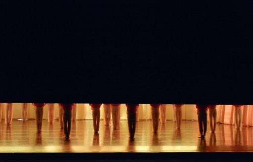 06 February 2019, Saxony, Leipzig: The curtain rises in the Leipzig Opera during rehearsal to form a ballet piece, feet and legs become visible. Photo: Volkmar Heinz\/dpa-Zentralbild\/