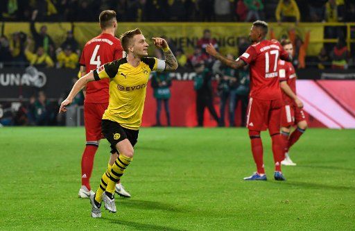 FILED - 10 November 2018, North Rhine-Westphalia, Dortmund: Soccer: Bundesliga, Borussia Dortmund - Bayern Munich, 11th matchday in Signal-Iduna Park. Marco Reus of Dortmund cheers the 2:2 against Munich. The BVB can again count on the services of Marco Reus in the champions summit on Saturday (06.04.2019) against FC Bayern. Inspired by the birth of his first child, the captain looks forward to the game with confidence. Photo: Ina Fassbender\/