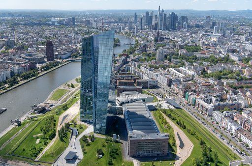 15 May 2019, Hessen, Frankfurt\/Main: The double tower of the ECB in the east of the city stands out from the bank skyline (photo from a helicopter). The Frankfurt skyline is one of the most frequently photographed motifs in Germany. Photo: Boris Roessler\/