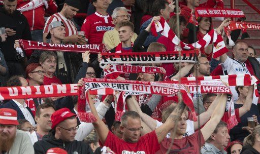 23 May 2019, Berlin: Fans of Union Berlin watch the football delegation match between VfB Stuttgart and Union Berlin at the Public Viewing in the Alte Försterei. Photo: Paul Zinken\/