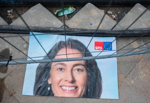 17 May 2029, Hessen, Frankfurt\/Main: A poster for the European elections with the portrait of Katarina Barley (SPD), Federal Minister of Justice and Consumer Protection, lies collapsed under a building fence. Barley is her party\