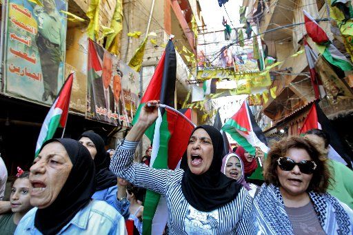 24 June 2019, Lebanon, Beirut: Palestinians womnn take part in a protest in Burj al-Barajneh refugee camp against Bahrain\