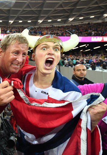 Karsten Warholm from Norway celebrates with fans from his country his victory at the men\