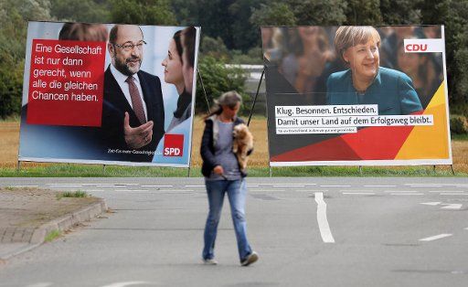 Election campaign posters with the leading candidates of the two major parties Angela Merkel (CDU) and Martin Schulz (SPD) can be seen next to each other in Nienhagen, Germany, 7 September 2017. The new Bundestag parliament is elected on 24 ...