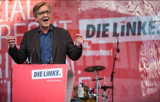 Dietmar Bartsch, chairman of Die Linke party and leading candidate of his party for the general elections, speaks at an election campaign event of his party on the Castle Square in Stuttgart, Germany, 12 September 2017. Photo: Christoph Schmidt\/