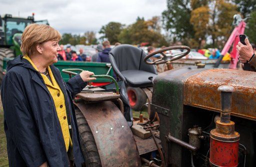 German chancellor Angela Merkel can be seen at her electoral district on the island of Ruegen, attending a harvest celebration in Lauterbach, German, 23 September 2017. After visiting Stralsund and Greifswald for campaign reasons she has now arrived ...