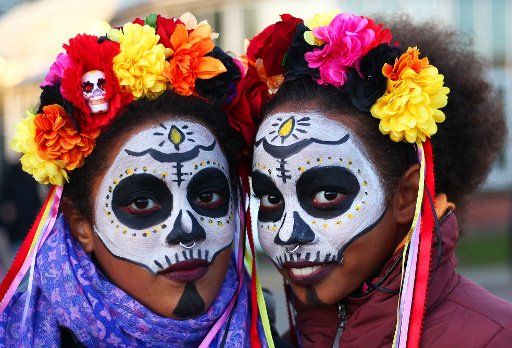 Two girls dressed in the voodoo look take part in the traditional Halloween festival at the botanical garden in Berlin Steglitz-Zehlendorf, Germany, 29 October 2017. Photo: Wolfram Steinberg\/