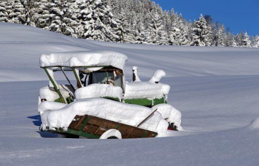 A snow covered tractor stands on a winterly landscape at Gunzesried, Germany, 29 December 2017. Photo: Karl-Josef Hildenbrand\/
