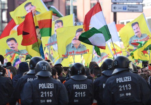 Participants at a Kurdish demonstration protesting against the Turkish military offensive in northern Syria, in Cologne, Germany, 27 Janaury 2018. Photo: Marius Becker\/