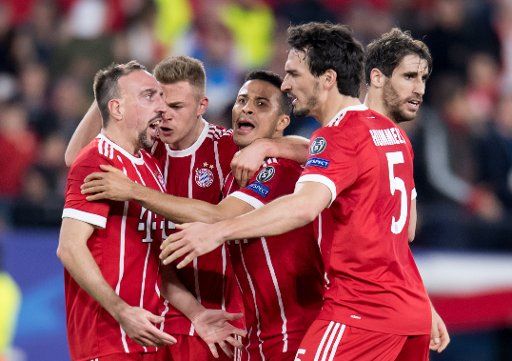 Bayern Munich players celebrate after scoring their first goal in a 2-1 win at Sevilla in the first leg of the Champions League quarter-final tie on Tuesday. From left to right, Franck Ribery, Joshua Kimmich, Thiago, Mats Hummels and Javi Martinez. Photo: Sven Hoppe\/dpa Photo: Sven Hoppe\/