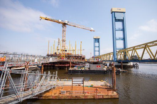 11 April 2018, Hamburg, Germany: View of the Kattwyk bridge and the construction site of a separate bridge for rail traffic . The Hamburg Port Authority presented Port\