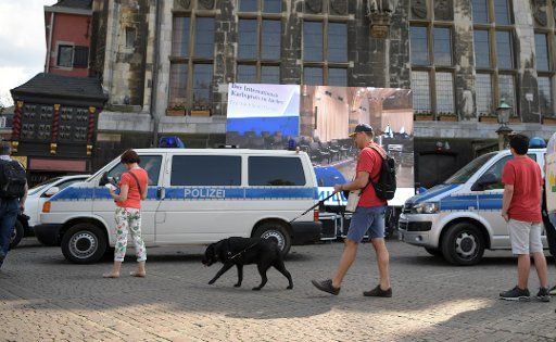 09 May 2018, Aachen, Germany: Police cars are parked in front of the town hall. The French President Macron receives the Charlemagne Prize for Ascension, to reward his powerful vision of a new Europe. Photo: Ina Fassbender\/