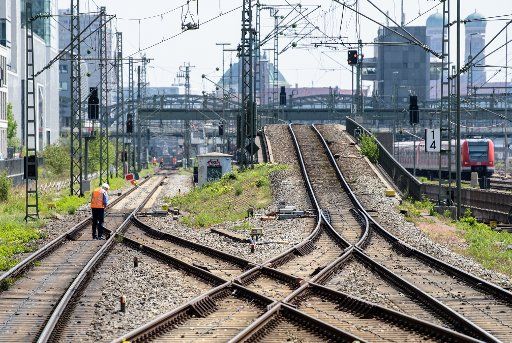12 May 2018, Germany, Munich: Construction workers are engaged in maintenance works on train tracks near Donnersberger Bridge. The tracks will be closed this weekend for a duration of 54 hours to allow for inspections and maintenance work. Photo: Matthias Balk\/