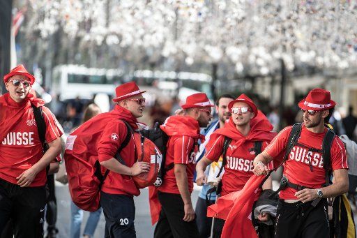15 June 2018, Russia, Moscow: Swiss fans marching through the city. Photo: Federico Gambarini\/
