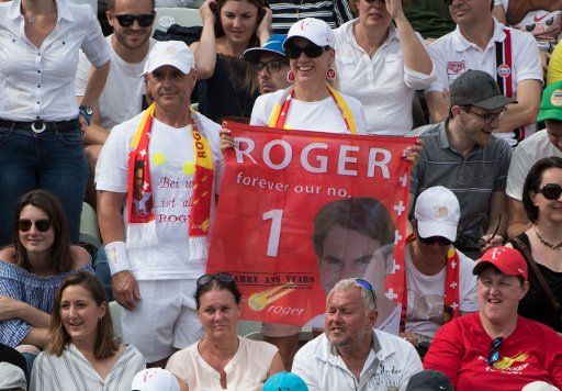 16 June 2018. Germany, Stuttgart, Tennis, ATP World Tour - Stuttgart, Singles, Men, Half finals, Federer (Switzerland) vs Kyrgios (Australia). Federer fans hold up a banner with the inscription \
