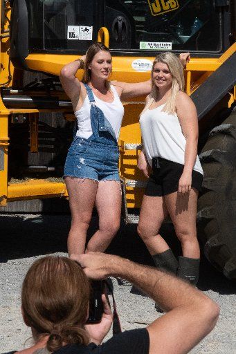 20 June 2018, Germany, Vilshofen: Sina (L) and Theresa posing during a press photo shoot for the Jungbauernkalender (lit. "young farmers\