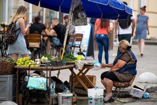 24 June 2018, Russia, Rostow am Don: Soccer, World Cup 2018: A woman selling vegetables on the street. Photo: Marius Becker\/