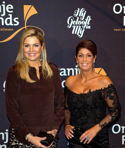 Queen Maxima of The Netherlands (L) and Rachel Hazes posing beside the musical \