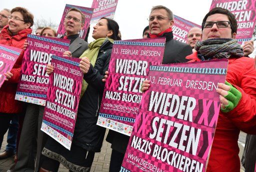 Politicians Heike Taubert (L-R), Bodo Ramelow, Anja Siegesmund, Uwe Hoehn (SPD) and Sabine Berninger stands outside of the Thuringian Parliament with posters against neo-Nazis in Erfurt, Germany, 05 February 2014. The poster campaign "Dresden Nazi-...