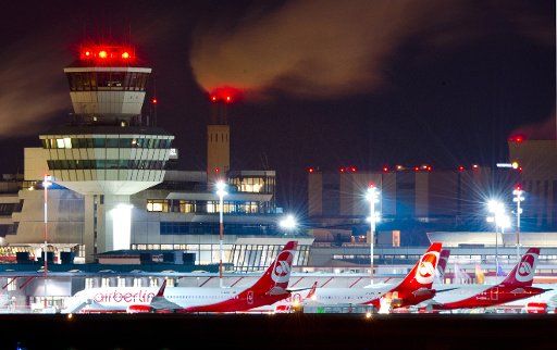 View of Tegel airport by night with the control tower and some airplanes of airline Air Berlin photographed in Berlin, Germany, 09 February 2014. Photo: Christoph