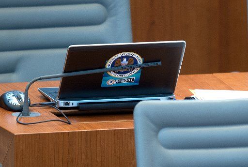 A laptop with the logo of the US National Security Agency (NSA) at a parliamentarian\