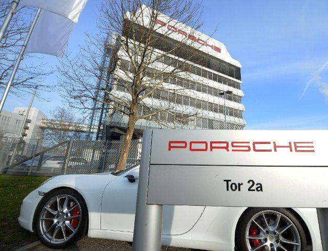 A sing reading Porsche outside of Porsche headquarters in Stuttgart-Zuffenhausen, Germany, 11 March 2014. The sports car manufacturer will discuss its results for 2013 on 14 March 2014. Photo: BERND 