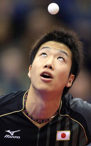 The Japanese player Jun Mizutani plays against the German player Mengel during the German Open at the Getec arena in Magdeburg, Germany, 30 March 2014. Photo: Jens Wolf\/