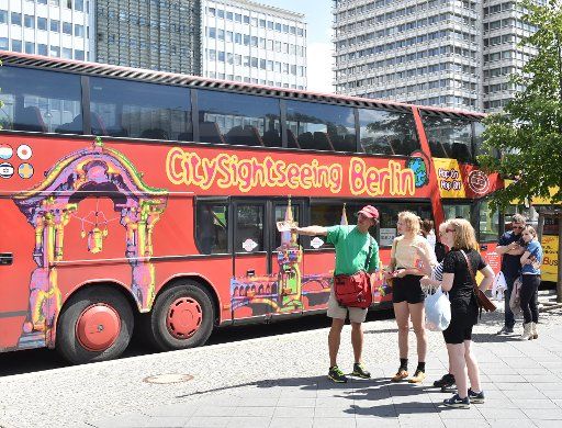 A sightseeing bus parks at Alexanderplatz in Berlin, Germany, 06 June 2014. Photo: Jens