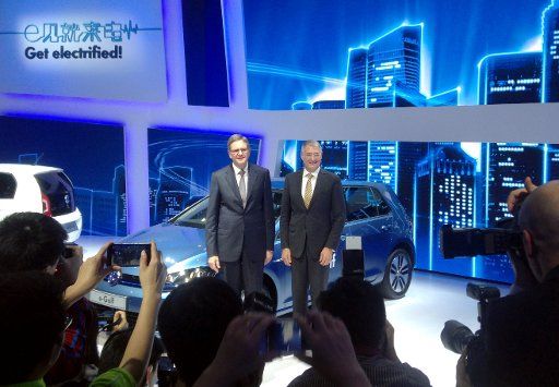 VW China chief Jochem Heizmann (L) and VW development chairman Hans-Jakob Neusser explain the company\