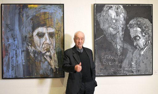 Actor Armin Mueller-Stahl in front of his paintings in the Taschenberg Palace Hotel in Dresden, Germany, 22 November 2014. 120 of his paintings and drawings are on display until 14 December 2014. Photo: MATTHIAS HIEKEL\/