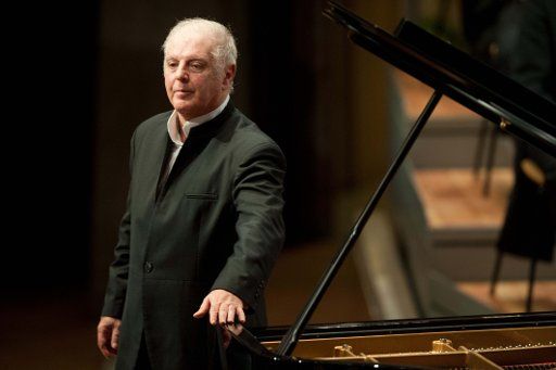 (FILE) - An archive picture dated 15 November 2012 shows conductor and pianist Daniel Barenboim bowing to the audience after his birthday concert in Berlin, Germany. On the occasion of his 70th birthday, he played Tchaikovsky\