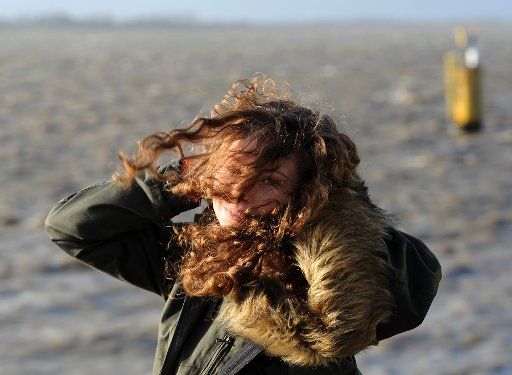 North Sea tourist Emily fights stormy weather on the Weser dyke in Bremerhaven, Germany, 2 January 2015. PHOTO: INGO WAGNER\/