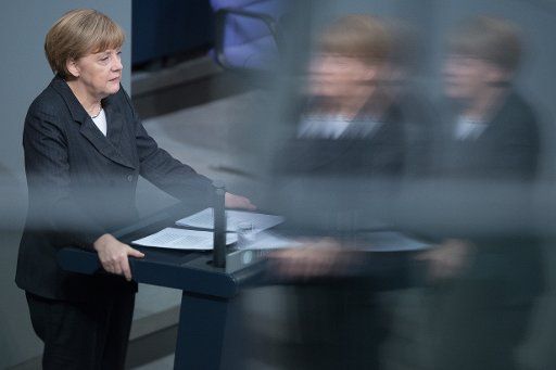 Chancellor Angela Merkel speaks at the Bundestag in Berlin, Germany, 15 January 2015. Photo: MAURIZIO GAMBARINI\/