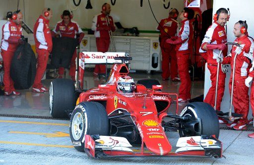 Finnish Formula One driver Kimi Raikkonen of Scuderia Ferrari steers the new SF15-T during the training session for the upcoming Formula One season at the Jerez racetrack in Jerez de la Frontera, Southern Spain, 04 February 2015. Photo: Peter ...